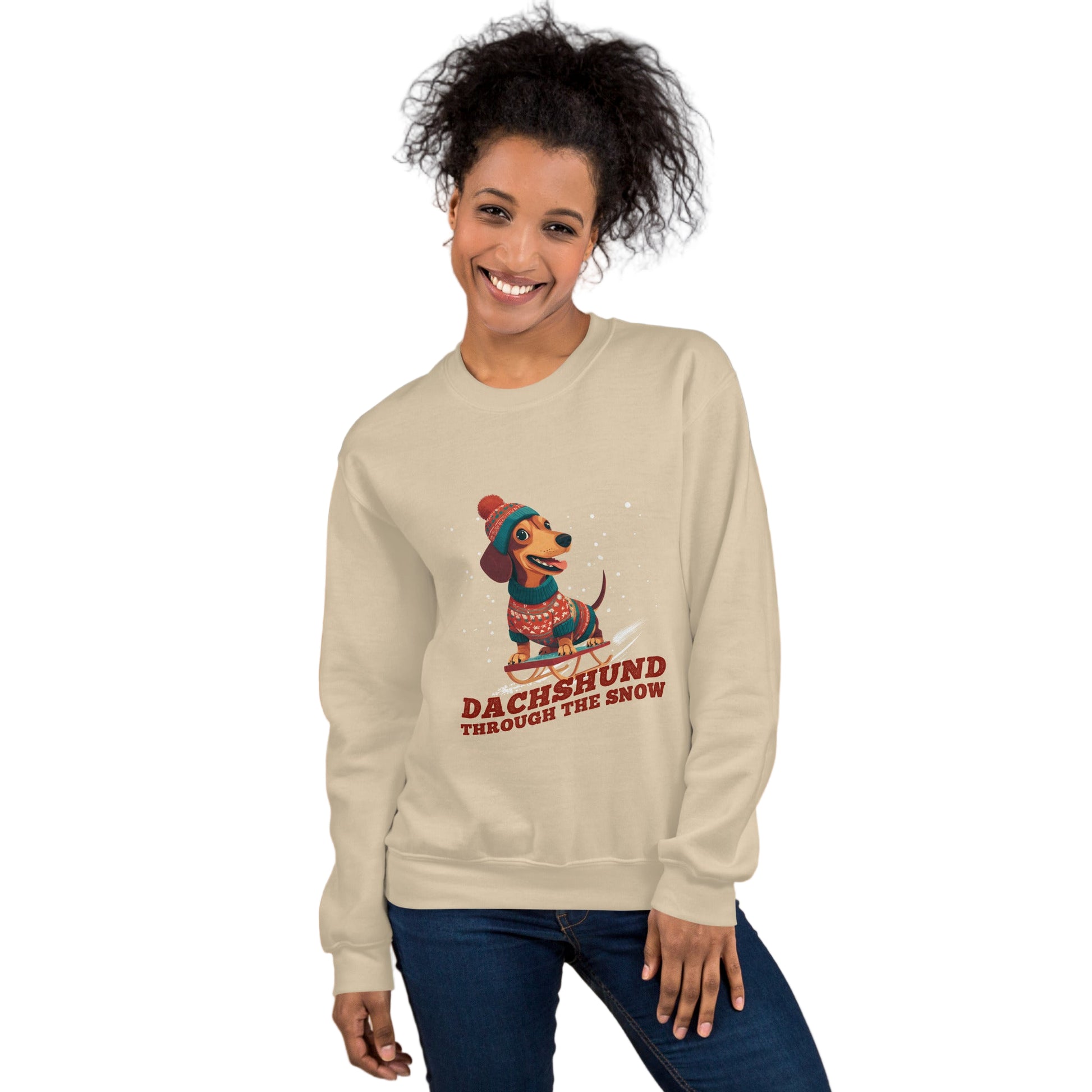 Woman wearing a beige sweatshirt with a dachshund graphic and text, standing against a plain background.