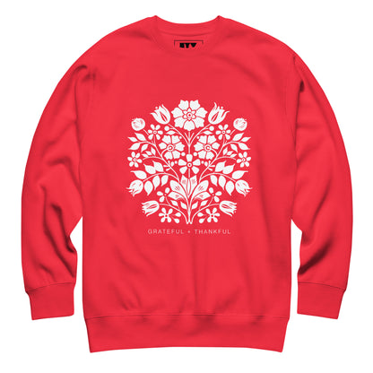 Red sweatshirt with white floral design and text on a white background