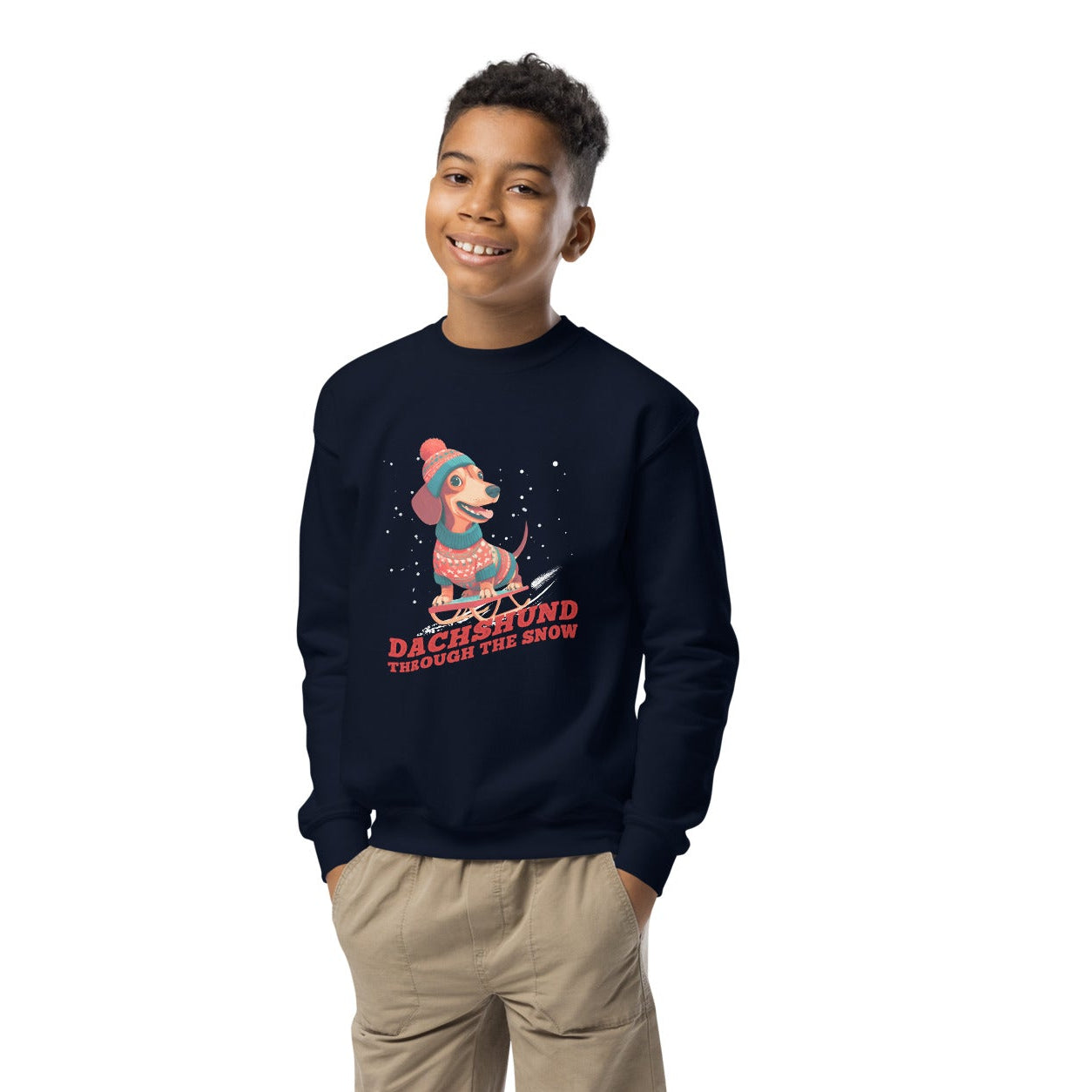 Child wearing a navy sweatshirt Dachshund through the snow design on a white background